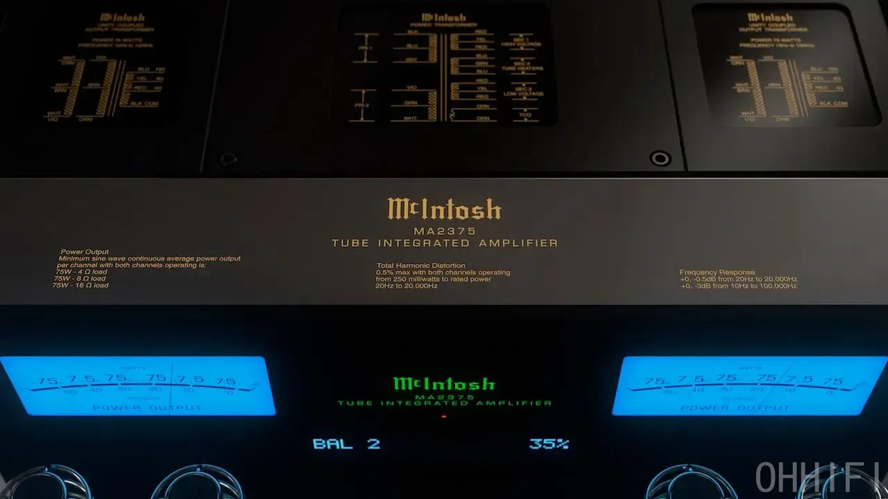 Detail of the McIntosh MA2375 front panel showing twin blue power output meters, the green display and printed specifications