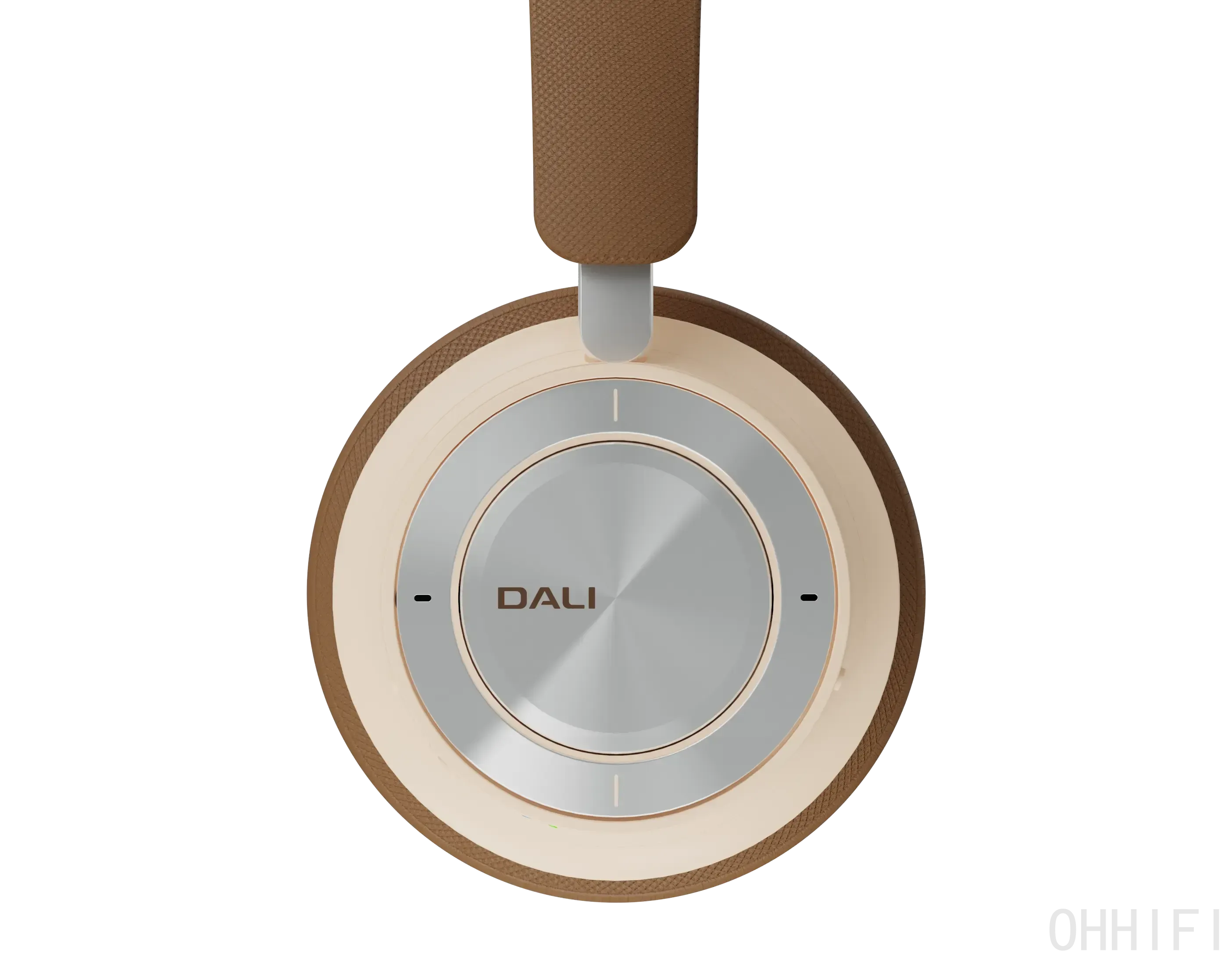Front view of the DALI IO-8 ear cup in Caramel White on black, showing the brushed aluminium control ring and centre button with the DALI logo.