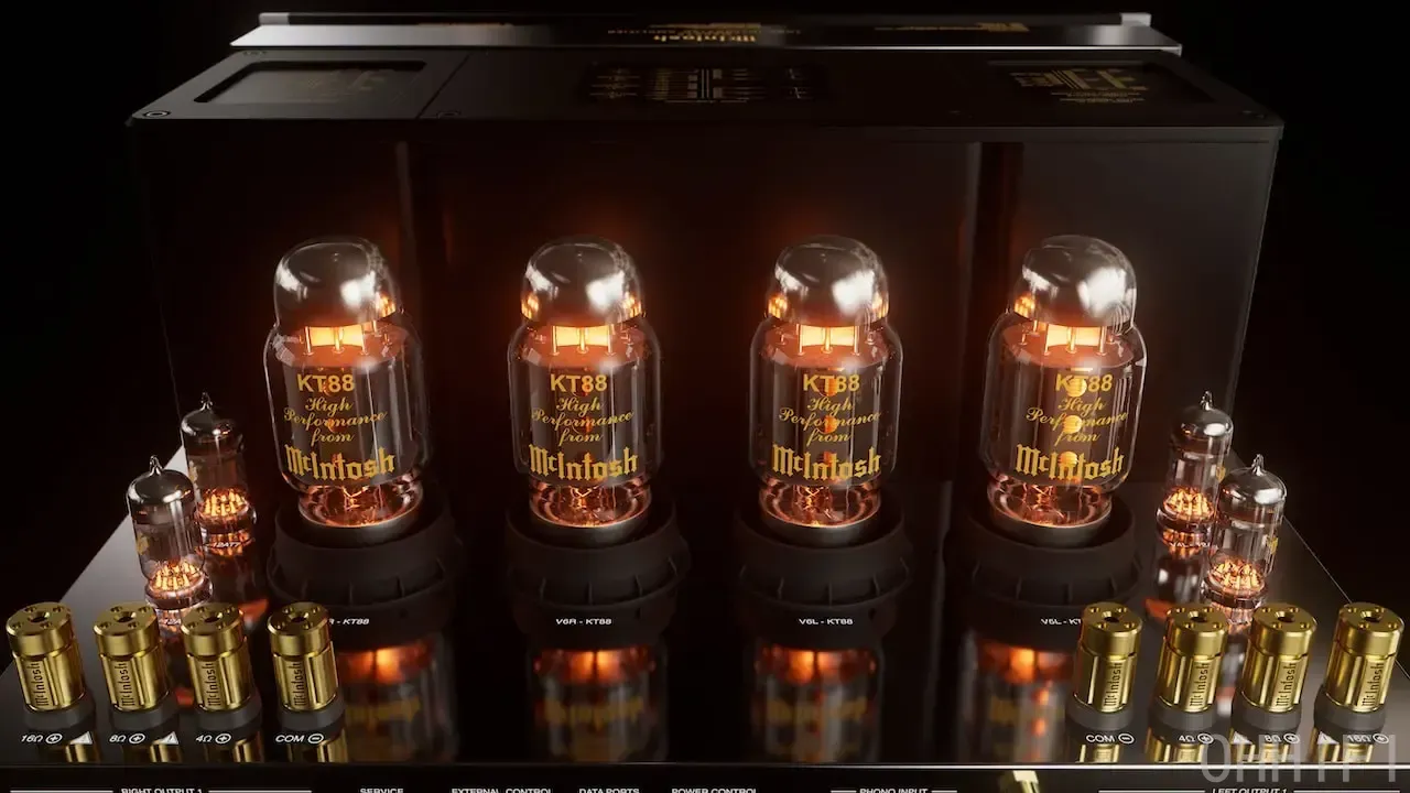 Close-up of the McIntosh MA2375 amplifier's four glowing KT88 output tubes and gold Solid Cinch speaker binding posts
