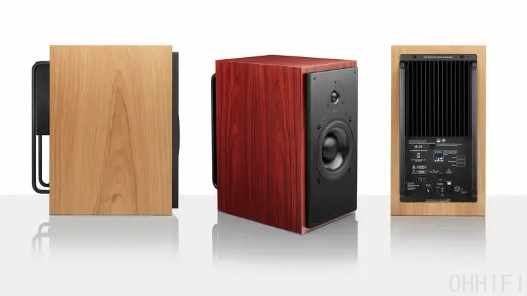 Three ATC SCM20ASL active speakers shown from the side, front and rear in oak and red wood veneer finishes.