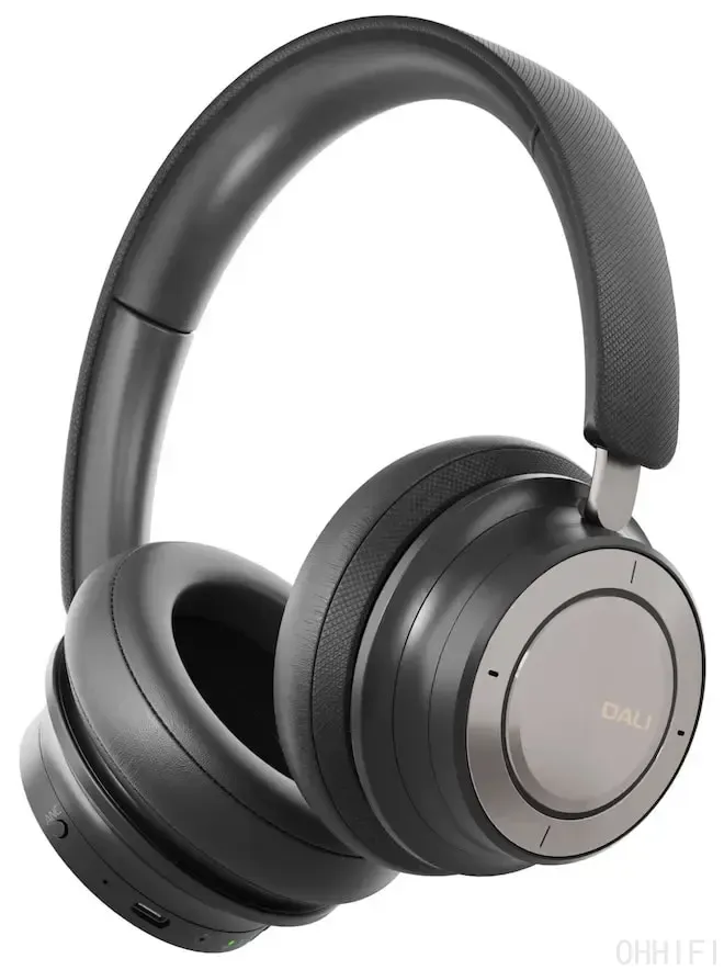 DALI IO-8 wireless ANC headphones in Iron Black, studio product shot showing the gunmetal ear cup dial, leather ear pads, USB-C port and physical controls.