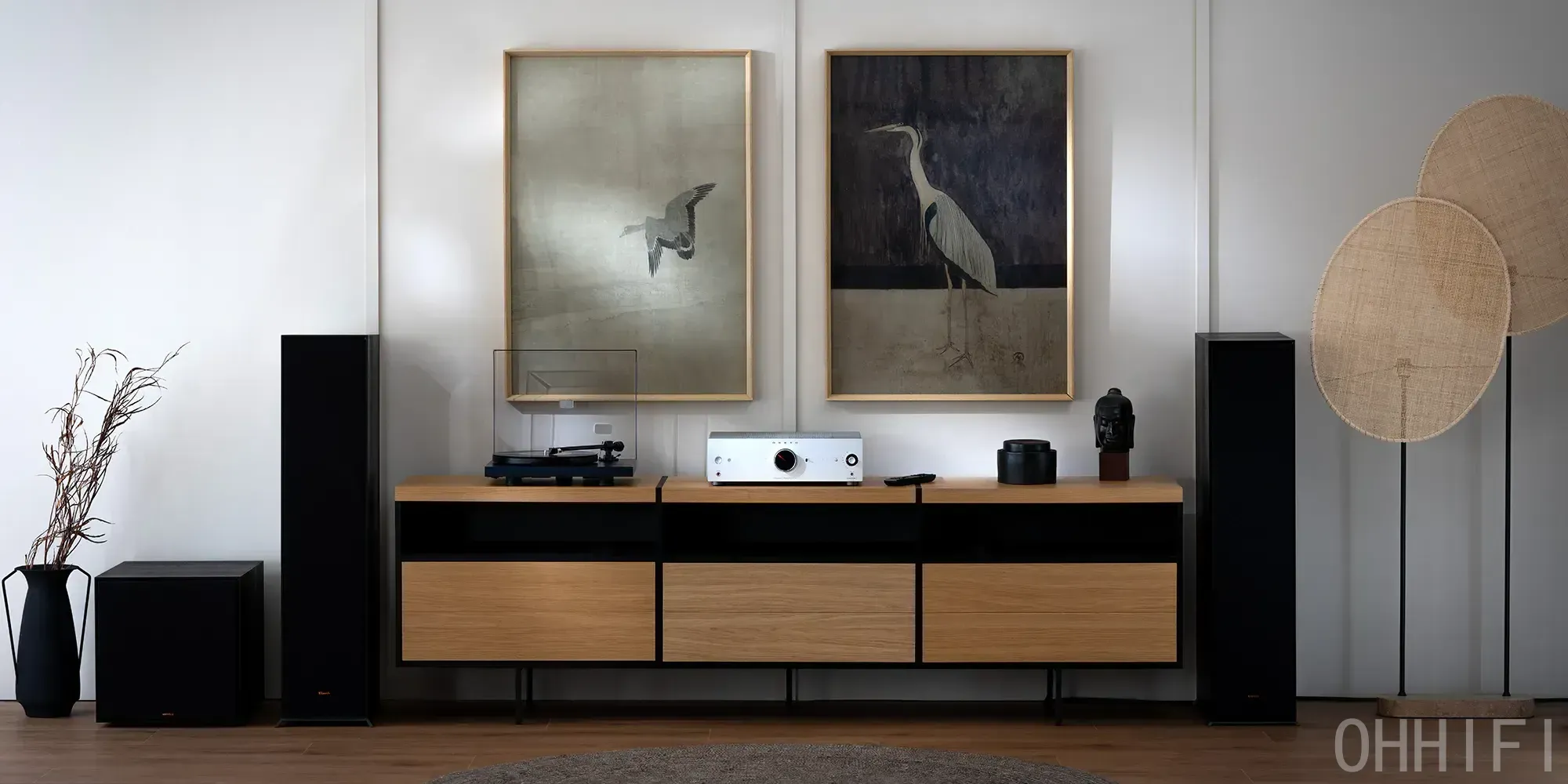 Onkyo Icon A-50 amplifier and turntable on an oak sideboard, flanked by black floorstanding speakers in a living room